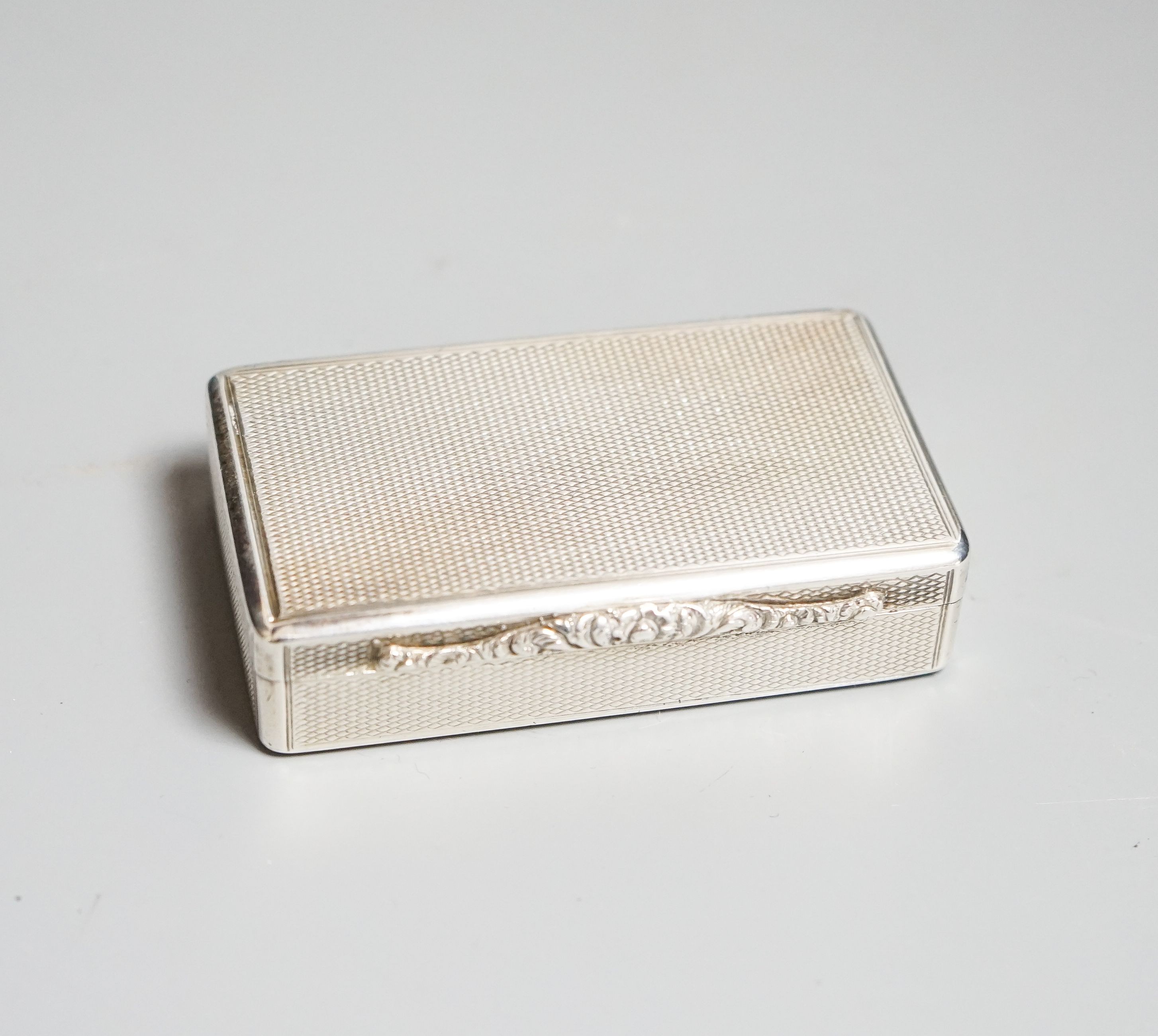 A George IV engine turned silver snuff box, Christian Reid, London, 1826, 72mm.